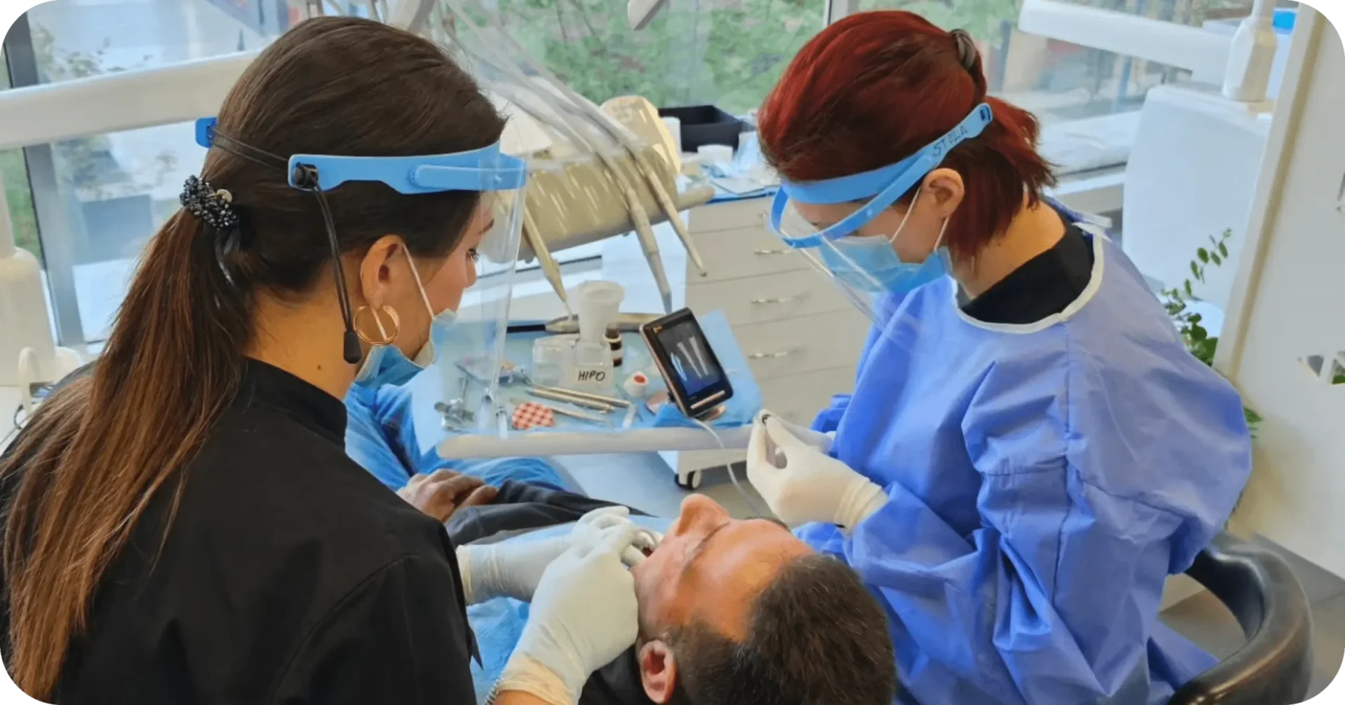 dentists performing dental surgery