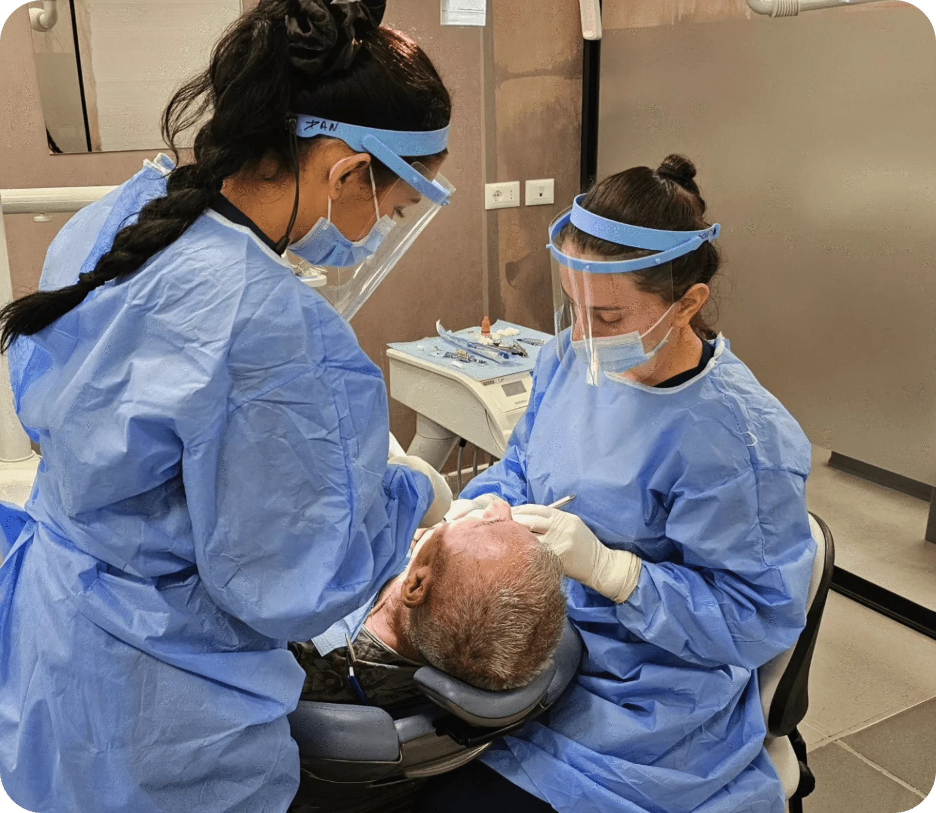 doctors performing dental surgery